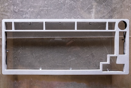 After what felt like an eternity, I finally finished sandblasting. Since I only want to paint the visible side of my keyboard, I don’t blast the whole thing.