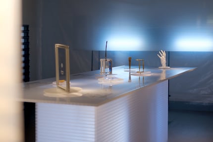 There are seven digital urns on the exhibition table.